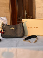 COACH BLACK PATTERN BAG WITH CHERRY CHARM AND 2 STRIPS