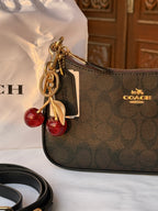 COACH BLACK PATTERN BAG WITH CHERRY CHARM AND 2 STRIPS