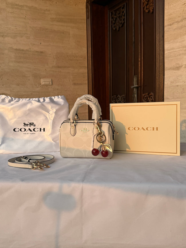 COACH WHITE PATTERN BAG WITH CHERRY CHARM Hover Image