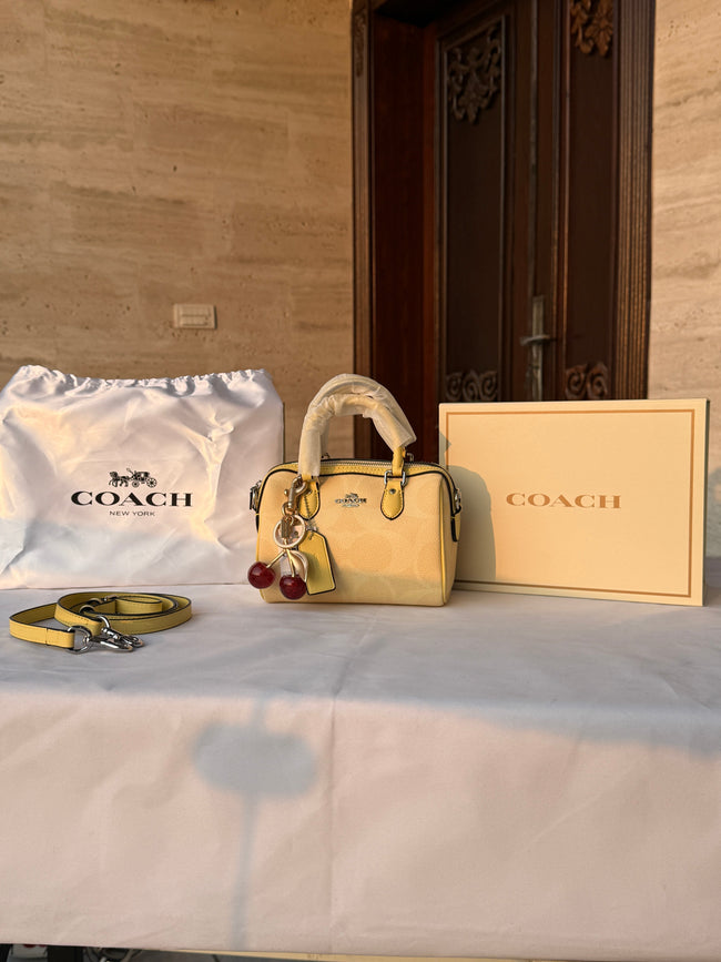 COACH LIGHT PASTEL YELLOW BAG WITH CHERRY CHARM Main Image