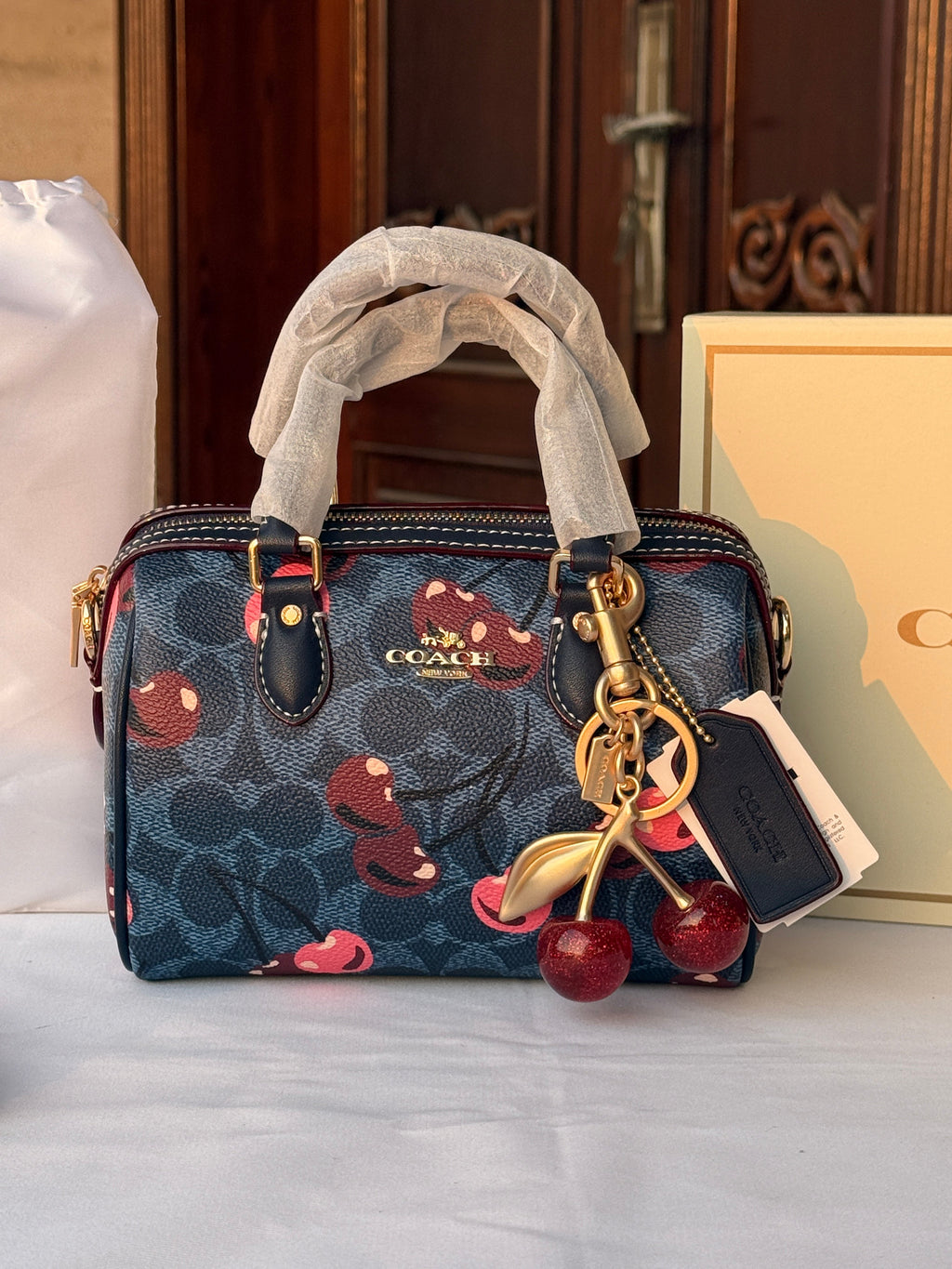 COACH BLUE BAG WITH CHERRY PATTERN AND CHERRY CHARM