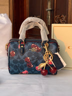 COACH BLUE BAG WITH CHERRY PATTERN AND CHERRY CHARM