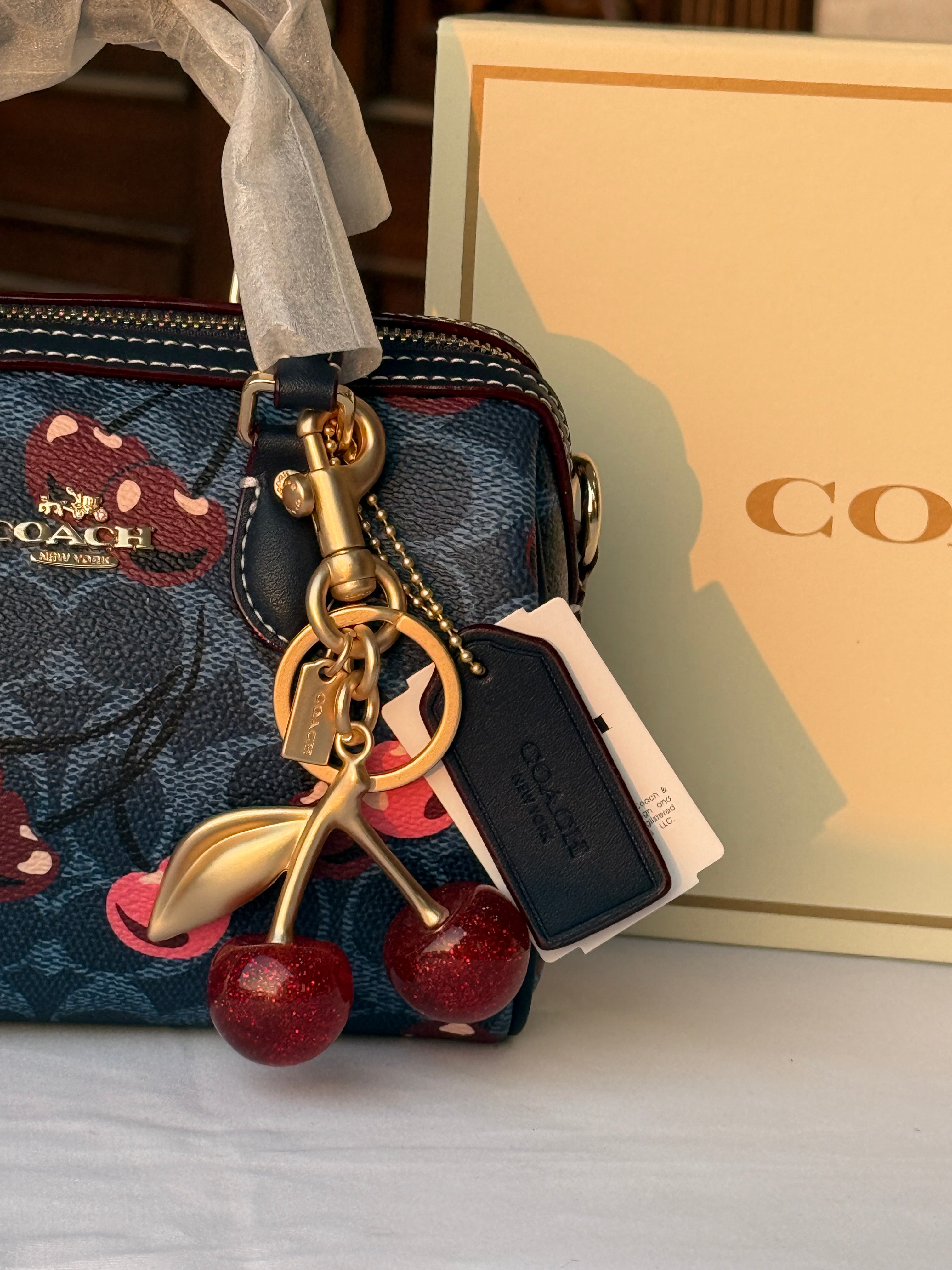COACH BLUE BAG WITH CHERRY PATTERN AND CHERRY CHARM