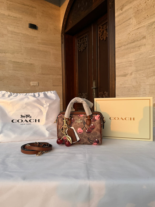 COACH LIGHT BROWN /TAN BASE CHERRY PATTERN BAG WITH CHERRY CHARM Hover Image