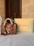 COACH LIGHT BROWN /TAN BASE CHERRY PATTERN BAG WITH CHERRY CHARM