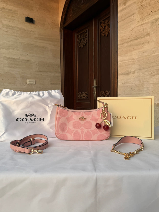COACH PINK BAG WITH CHERRY CHARM AND 2 STRIPS Hover Image